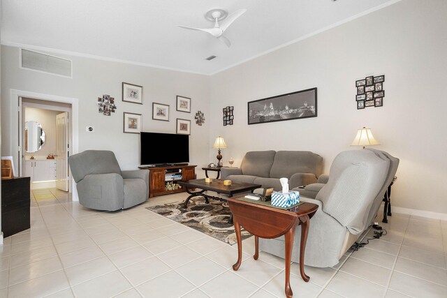 7770 SE Spicewood Cir, Hobe Sound, FL 33455 - living area featuring a ceiling fan, light tile patterned flooring, ornamental molding, and baseboards