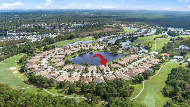 7770 SE Spicewood Cir, Hobe Sound, FL 33455 - view of property location featuring nearby suburban area, a large body of water, and a local golf course