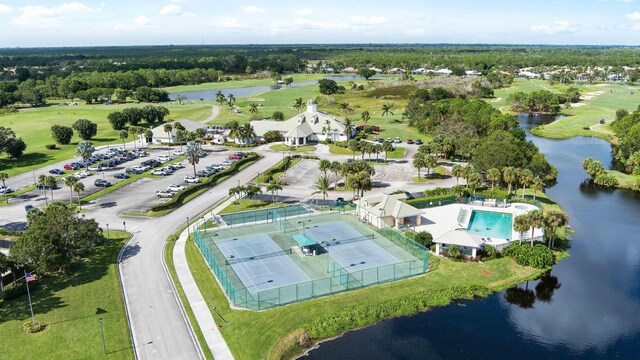 7770 SE Spicewood Cir, Hobe Sound, FL 33455 - aerial view of property and surrounding area with a large body of water, a local golf course, and a pool