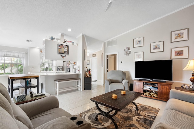 living room featuring light tile patterned flooring, a textured ceiling, lofted ceiling, and crown molding