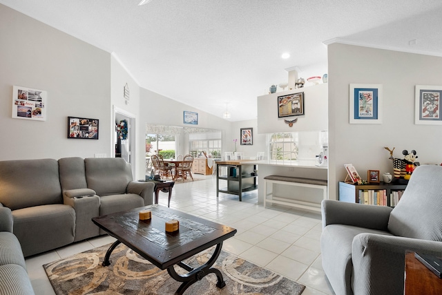 tiled living room with high vaulted ceiling, a textured ceiling, ornamental molding, and plenty of natural light