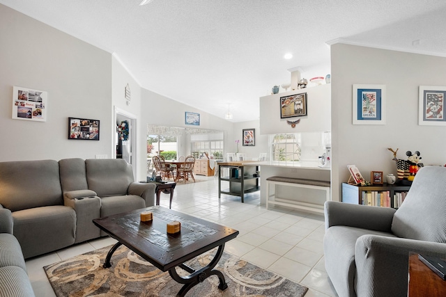 7770 SE Spicewood Cir, Hobe Sound, FL 33455 - living room with light tile patterned floors, vaulted ceiling, and a textured ceiling