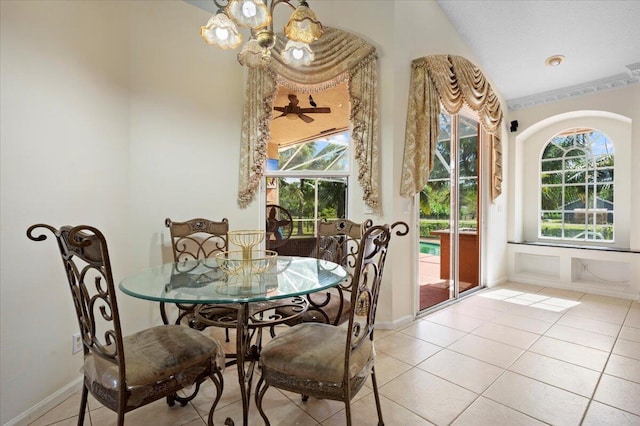 tiled dining space with plenty of natural light and a chandelier