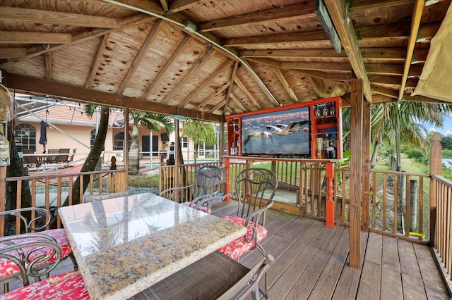 wooden terrace featuring a gazebo