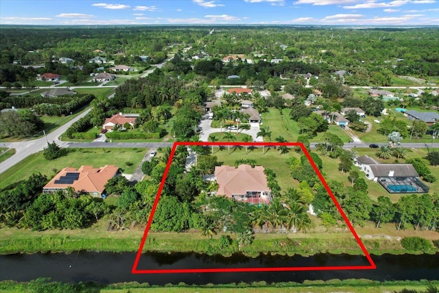 birds eye view of property featuring a water view