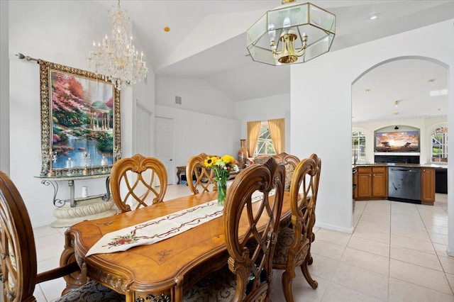 tiled dining space featuring high vaulted ceiling