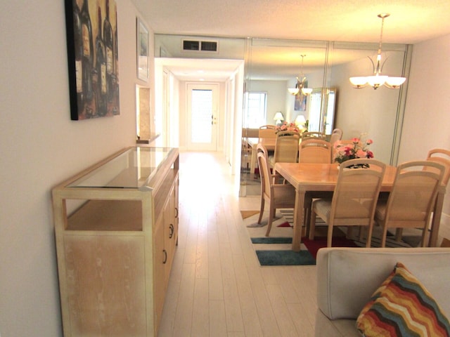 dining area with light hardwood / wood-style floors