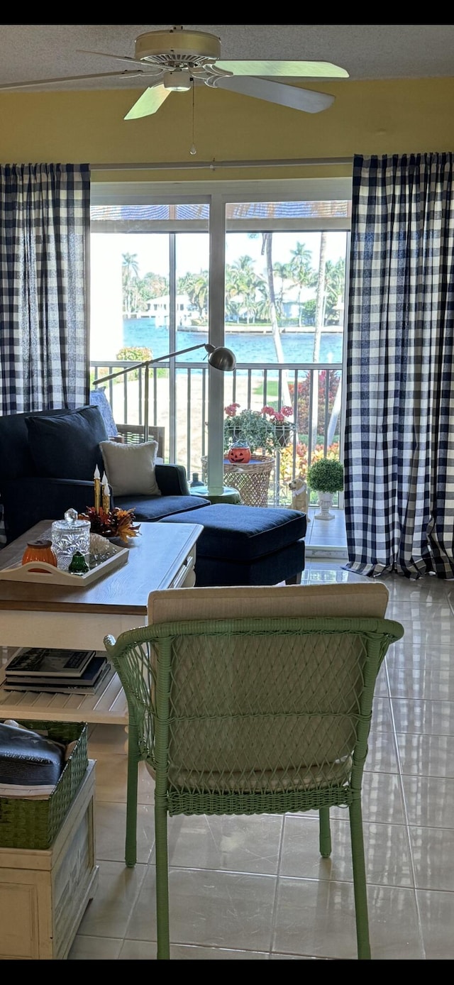 646 Snug Harbor Dr Unit H209, Boynton Beach, FL 33435 - living area with light tile patterned floors and a ceiling fan