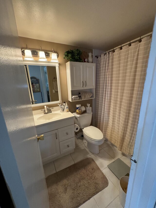 646 Snug Harbor Dr Unit H209, Boynton Beach, FL 33435 - bathroom featuring tile patterned flooring, vanity, and curtained shower