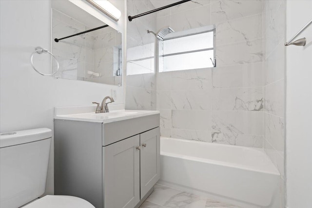 full bathroom with vanity, toilet, and tiled shower / bath