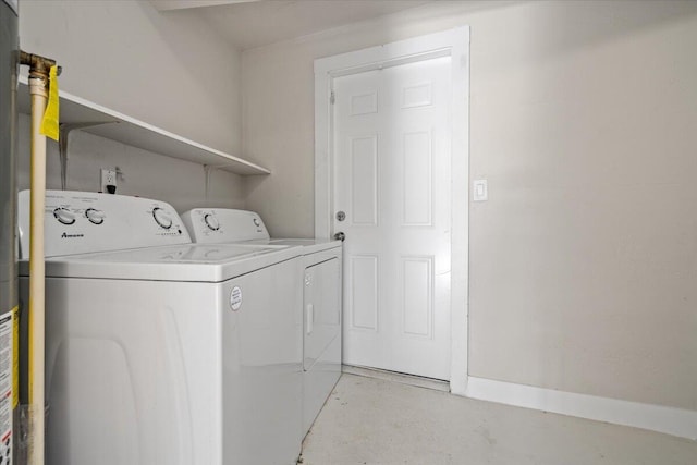 clothes washing area featuring independent washer and dryer