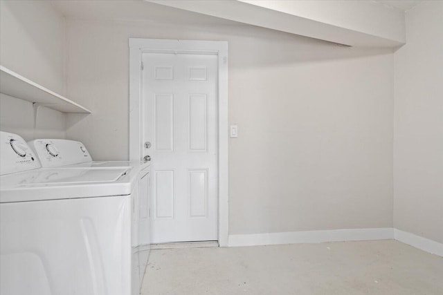 laundry room featuring washing machine and clothes dryer