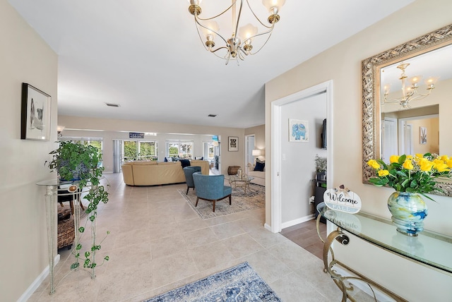 interior space featuring light tile patterned floors and an inviting chandelier