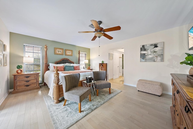 bedroom with ceiling fan and light hardwood / wood-style flooring