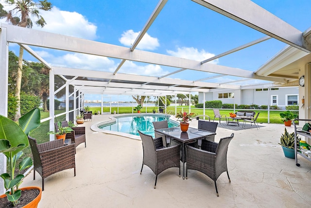 view of patio featuring a lanai