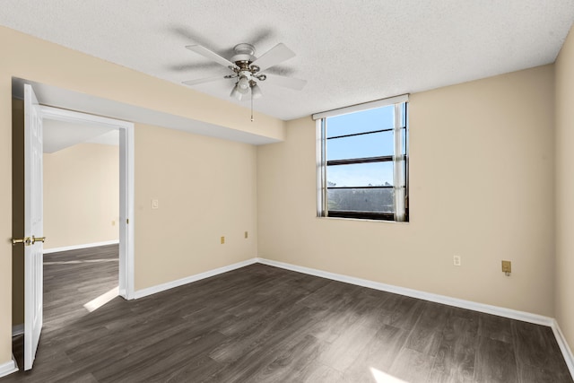 unfurnished room with ceiling fan, dark hardwood / wood-style floors, and a textured ceiling