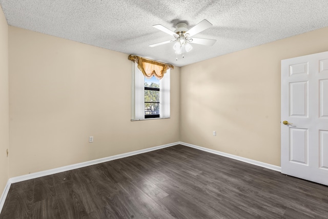 spare room with dark hardwood / wood-style flooring, a textured ceiling, and ceiling fan