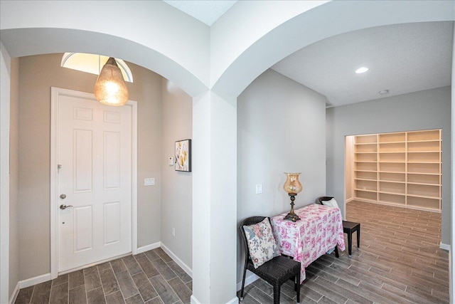 entryway with dark wood-type flooring