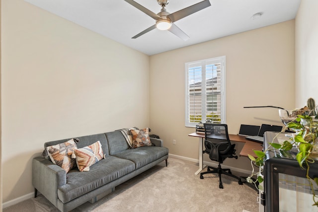 carpeted home office with ceiling fan