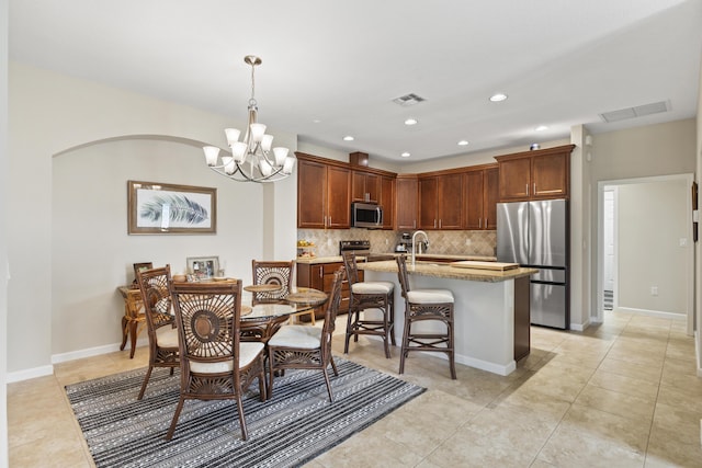 dining space with baseboards, light tile patterned floors, visible vents, and recessed lighting