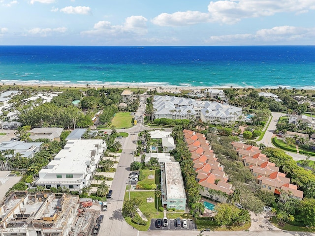 birds eye view of property featuring a view of the beach and a water view