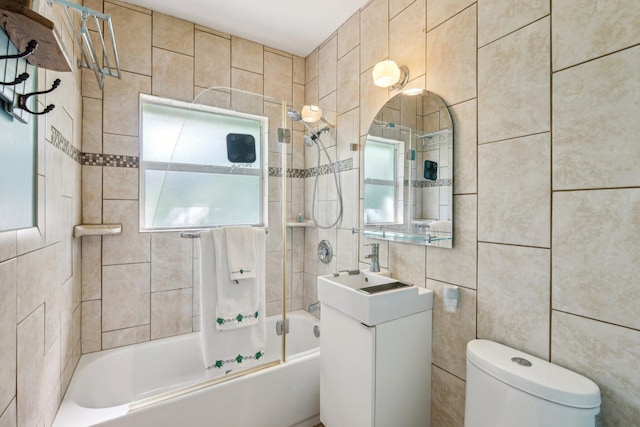 1006 Casuarina Rd Unit 11, Delray Beach, FL 33483 - bathroom featuring tile walls, shower / tub combination, toilet, and vanity