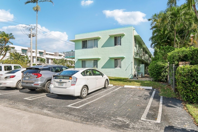 1006 Casuarina Rd Unit 11, Delray Beach, FL 33483 - view of front of property with uncovered parking and stucco siding