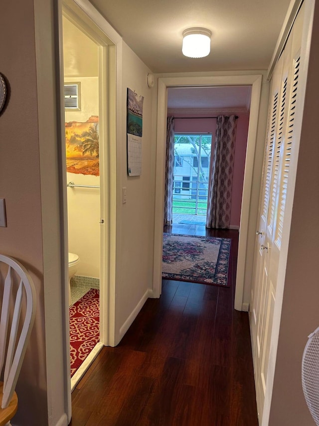 corridor featuring dark hardwood / wood-style flooring