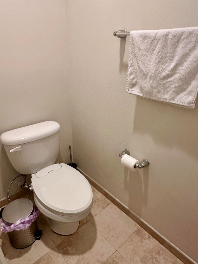 bathroom featuring tile patterned flooring and toilet