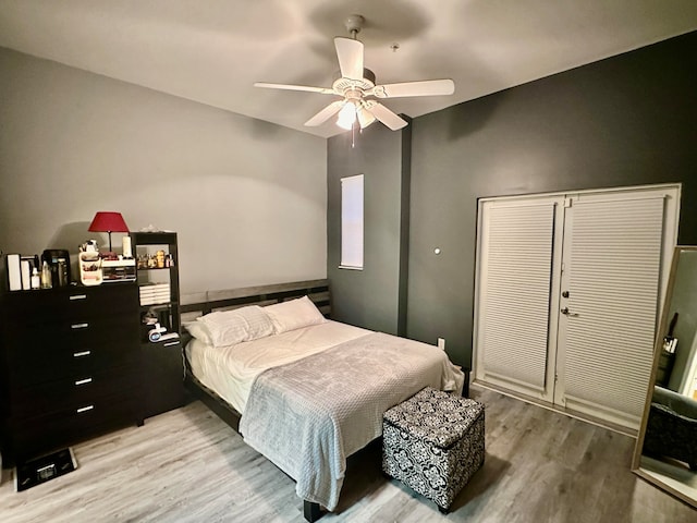 bedroom with ceiling fan and wood-type flooring