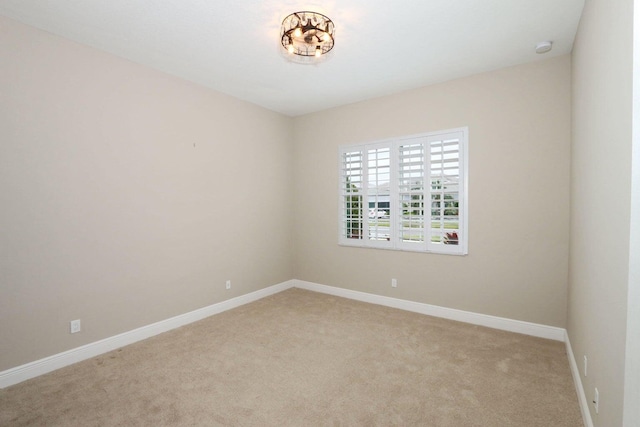 empty room featuring light carpet