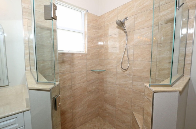 bathroom with a tile shower