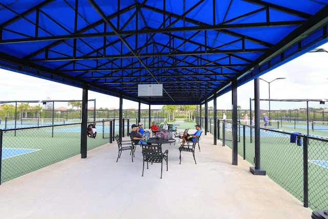 view of patio with tennis court