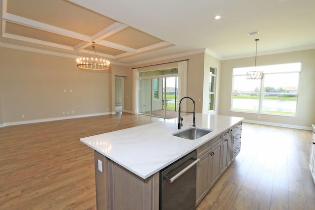 kitchen with sink, an island with sink, stainless steel dishwasher, and plenty of natural light