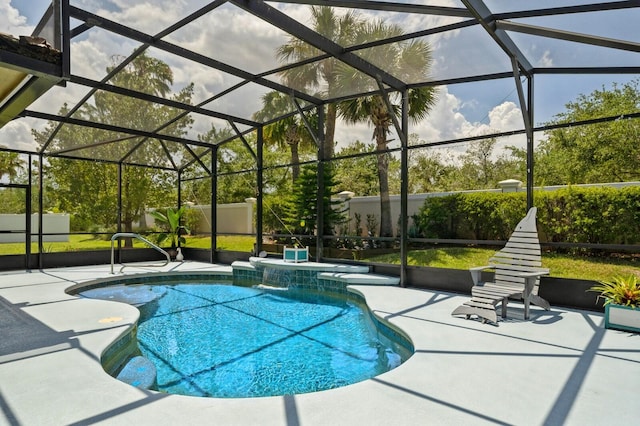 view of pool featuring glass enclosure, pool water feature, and a patio area