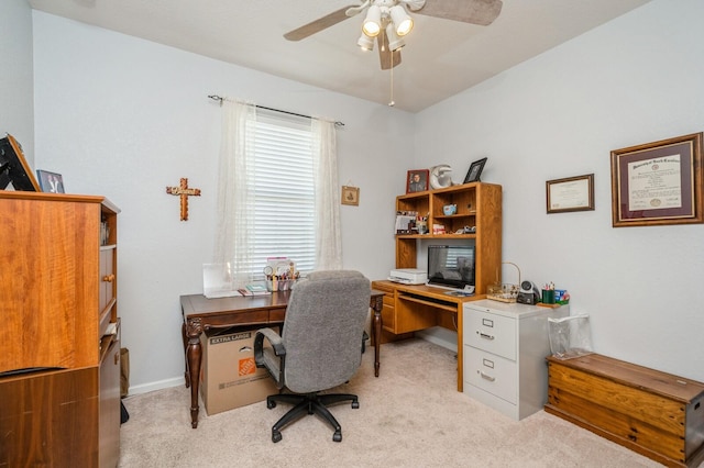 carpeted home office with ceiling fan