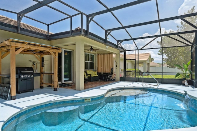 view of swimming pool with a patio area, a grill, pool water feature, a lanai, and ceiling fan