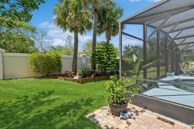 view of yard with a lanai