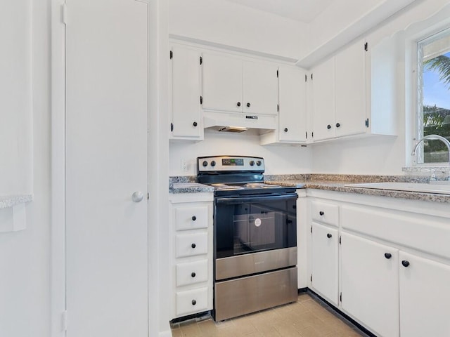 kitchen featuring white cabinetry, stainless steel range with electric cooktop, and sink