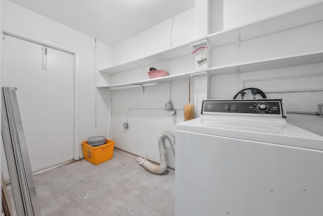 clothes washing area featuring washer / dryer