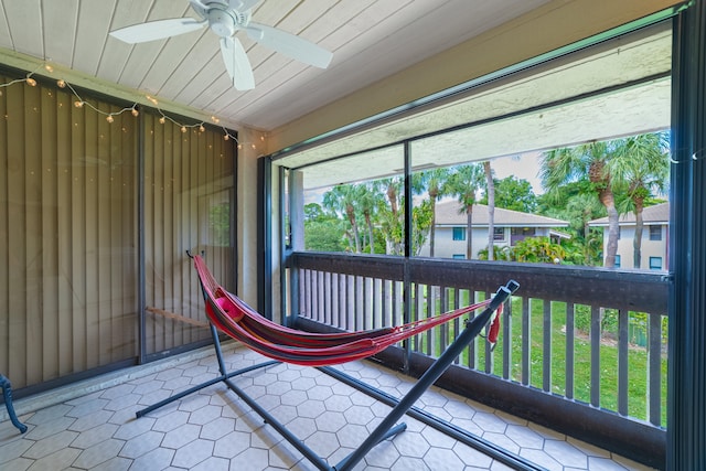 unfurnished sunroom with wood ceiling