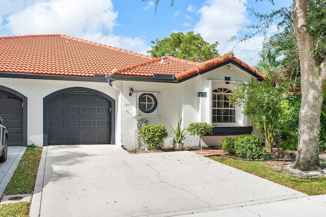 mediterranean / spanish-style house featuring a garage