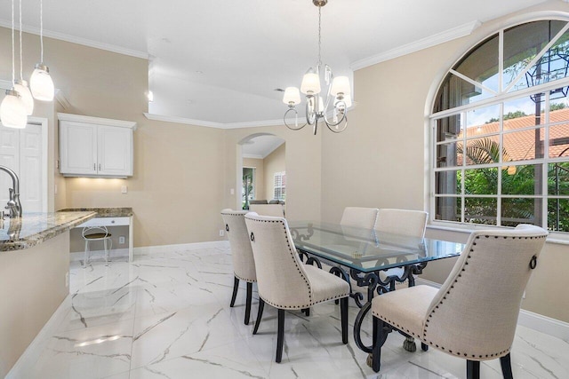 dining room featuring a notable chandelier and ornamental molding