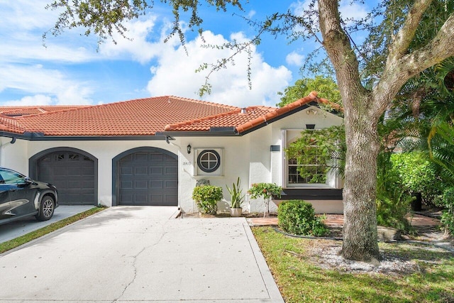 mediterranean / spanish house with a garage