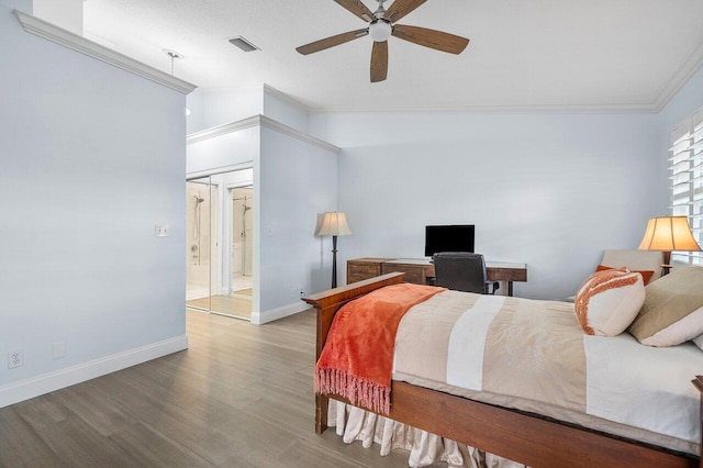 bedroom featuring hardwood / wood-style flooring, ceiling fan, crown molding, and lofted ceiling