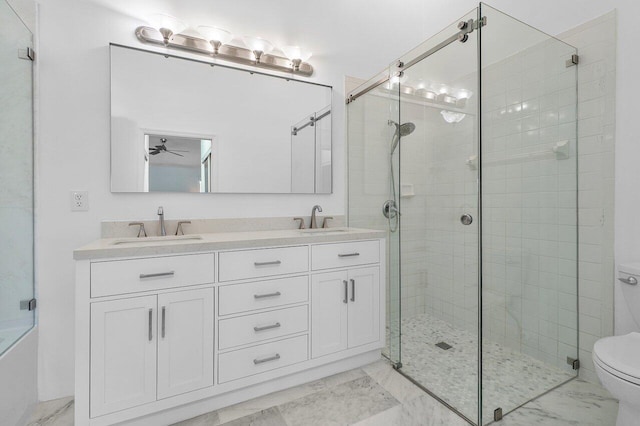 bathroom with walk in shower, ceiling fan, vanity, and toilet