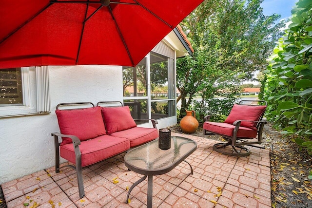 view of patio with a sunroom