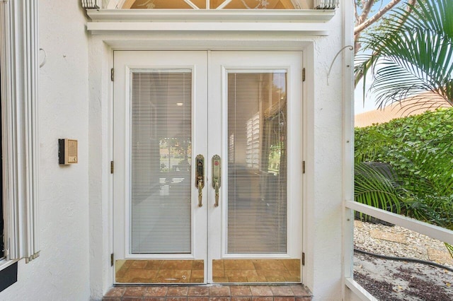 property entrance featuring french doors