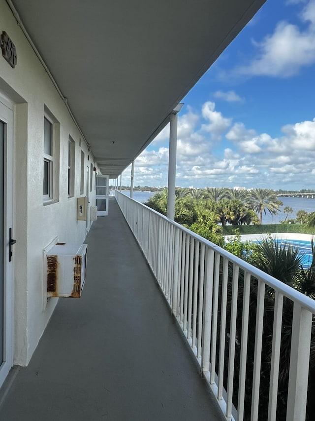 balcony featuring a water view