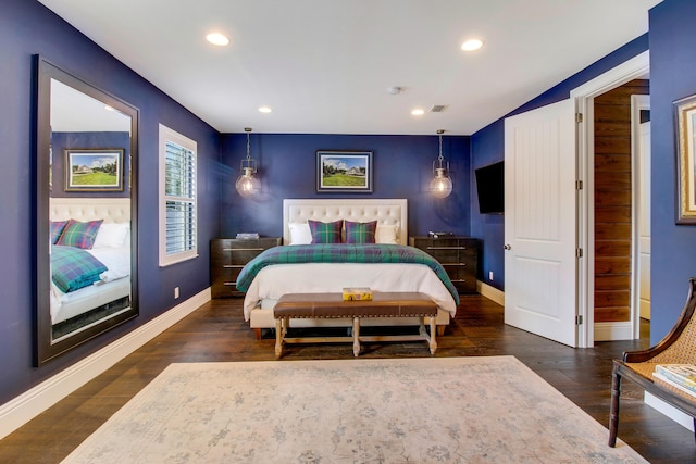 bedroom with dark wood-type flooring